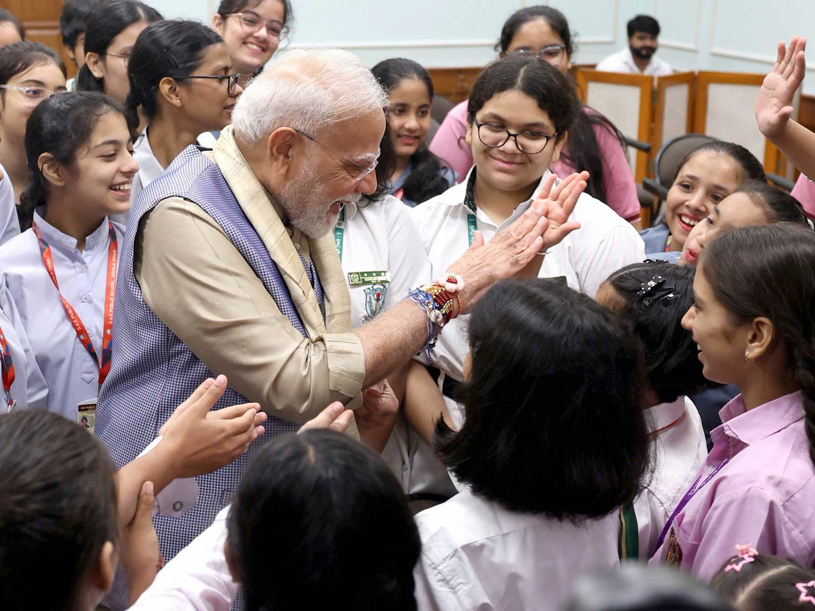 PM Modi and other leaders celebrate Raksha Bandhan with schoolgirls
